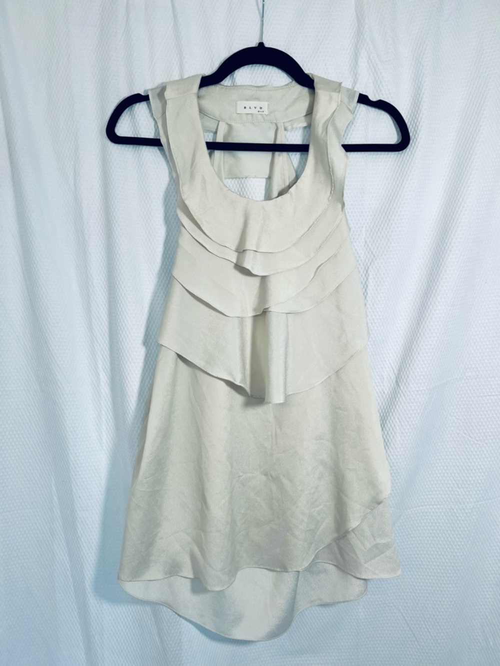 BLVD Cream Layered Ruffle Sleeveless Top With open back